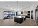 Gourmet kitchen with large island, stainless steel appliances, and wood flooring at 0 N Bell Rd # 4, Queen Creek, AZ 85144
