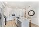 Modern kitchen with white cabinets, stainless steel appliances and an island at 3131 N Central Ave # 3019, Phoenix, AZ 85012