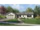 Craftsman style home exterior with two car garage and landscaped yard at 3942 E Penedes Dr, Gilbert, AZ 85298