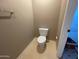 Simple bathroom with a toilet and tiled floor at 39995 N Prince N Ave, San Tan Valley, AZ 85140