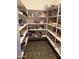 Well-stocked pantry with ample shelving for storage at 39995 N Prince N Ave, San Tan Valley, AZ 85140