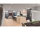 Modern kitchen with large island, stainless steel appliances, and open layout at 6932 E 1St St, Scottsdale, AZ 85251