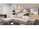 Open concept living space with modern sectional sofa and kitchen views at 6932 E 1St St, Scottsdale, AZ 85251