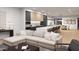 Open concept living space with modern sectional sofa and kitchen views at 6932 E 1St St, Scottsdale, AZ 85251