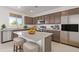 Modern kitchen with granite countertops and stainless steel appliances at 10746 E Dragoon Cir, Mesa, AZ 85208