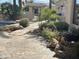 Inviting backyard with a sparkling pool, stone patio, and lush landscaping at 10100 N 78Th Pl, Scottsdale, AZ 85258