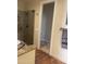 Bathroom with granite countertop, shower, and access to another room at 10100 N 78Th Pl, Scottsdale, AZ 85258