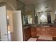 Large bathroom with double vanity and glass block window at 10100 N 78Th Pl, Scottsdale, AZ 85258