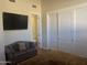 Bedroom with ensuite bathroom, large closet, and comfy seating at 10100 N 78Th Pl, Scottsdale, AZ 85258