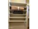 Shelved closet with ample storage space for folded clothes and blankets at 10100 N 78Th Pl, Scottsdale, AZ 85258