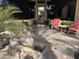 Inviting front entrance with stone pathway,water feature & comfortable seating at 10100 N 78Th Pl, Scottsdale, AZ 85258