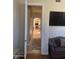 View down a hallway showcasing wood floors and access to other rooms at 10100 N 78Th Pl, Scottsdale, AZ 85258