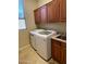 Bright laundry room, featuring washer, dryer, and ample cabinetry at 10100 N 78Th Pl, Scottsdale, AZ 85258