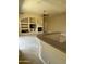 Living room with a fireplace and built-in shelving at 10100 N 78Th Pl, Scottsdale, AZ 85258