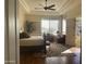 Main bedroom with hardwood floors and access to patio at 10100 N 78Th Pl, Scottsdale, AZ 85258