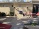 Outdoor patio with built-in grill and seating area at 10100 N 78Th Pl, Scottsdale, AZ 85258