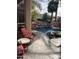Relaxing pool area with a waterfall and comfortable lounge chairs at 10100 N 78Th Pl, Scottsdale, AZ 85258