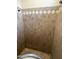 Shower with granite tile and a built-in seat at 10100 N 78Th Pl, Scottsdale, AZ 85258