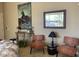 Cozy sitting area with two armchairs, a console table, and artwork at 10100 N 78Th Pl, Scottsdale, AZ 85258