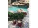 Inviting pool area with a rock waterfall and landscaping at 10100 N 78Th Pl, Scottsdale, AZ 85258