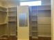 Large walk-in closet with ample shelving and hanging space at 10100 N 78Th Pl, Scottsdale, AZ 85258