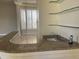 Wet bar with granite countertop and glass shelving at 10100 N 78Th Pl, Scottsdale, AZ 85258
