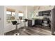 Modern kitchen with dark cabinetry and breakfast bar at 7233 W Corrine Dr, Peoria, AZ 85381