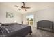 Bedroom with two twin beds, crib, and sliding door to balcony at 7233 W Corrine Dr, Peoria, AZ 85381