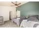 Bright bedroom with two twin beds, ceiling fan, and ample closet space at 7233 W Corrine Dr, Peoria, AZ 85381