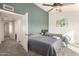 Spacious bedroom with two twin beds, ceiling fan, and access to hallway at 7233 W Corrine Dr, Peoria, AZ 85381
