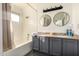 Bathroom with double vanity, bathtub, and updated fixtures at 7233 W Corrine Dr, Peoria, AZ 85381