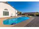 Inviting kidney shaped pool with brick coping and a lounge chair at 7233 W Corrine Dr, Peoria, AZ 85381