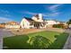 Large backyard with a grassy area, pool, and house view at 7233 W Corrine Dr, Peoria, AZ 85381
