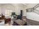 Spacious living room with foosball table and high ceilings at 7233 W Corrine Dr, Peoria, AZ 85381
