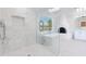 Spa-like bathroom with a large walk-in shower, soaking tub, and marble tile at 8130 E Vista Bonita Dr, Scottsdale, AZ 85255