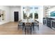 Elegant dining room with a large table, statement chandelier, and built-in bar at 8130 E Vista Bonita Dr, Scottsdale, AZ 85255