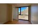 Bright bedroom with large window offering scenic views at 4849 N Camelback Ridge Rd # B201, Scottsdale, AZ 85251