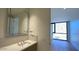 Clean bathroom with vanity and view into bedroom at 4849 N Camelback Ridge Rd # B201, Scottsdale, AZ 85251