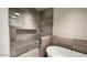 Elegant bathroom featuring a soaking tub and shower at 4849 N Camelback Ridge Rd # B201, Scottsdale, AZ 85251
