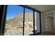 Bedroom with large window showcasing mountain views at 4849 N Camelback Ridge Rd # B201, Scottsdale, AZ 85251