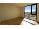 Light-filled bedroom with large window and city views at 4849 N Camelback Ridge Rd # B201, Scottsdale, AZ 85251