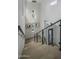 Modern glass and metal staircase with light oak treads at 37200 N Cave Creek Rd # 2120, Scottsdale, AZ 85262