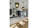 Modern kitchen with a large island, pendant lighting, and a stylish backsplash at 37200 N Cave Creek Rd # 2120, Scottsdale, AZ 85262