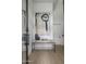 Bright and airy entryway with contemporary console table and large artwork at 37200 N Cave Creek Rd # 2120, Scottsdale, AZ 85262