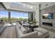 Living area with sectional sofa, fireplace and golf course views at 37200 N Cave Creek Rd # 2120, Scottsdale, AZ 85262