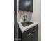 Modern laundry room with a utility sink and cabinetry at 37200 N Cave Creek Rd # 2120, Scottsdale, AZ 85262