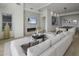 Spacious living room with a cozy sectional sofa and fireplace at 37200 N Cave Creek Rd # 2120, Scottsdale, AZ 85262