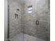 Walk-in shower with neutral tile and glass enclosure at 37200 N Cave Creek Rd # 2120, Scottsdale, AZ 85262