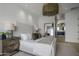 Bright bedroom with a comfortable bed, stylish furniture, and ensuite bathroom at 37200 N Cave Creek Rd # 2120, Scottsdale, AZ 85262
