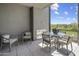 Covered patio with seating area and fireplace at 37200 N Cave Creek Rd # 2120, Scottsdale, AZ 85262
